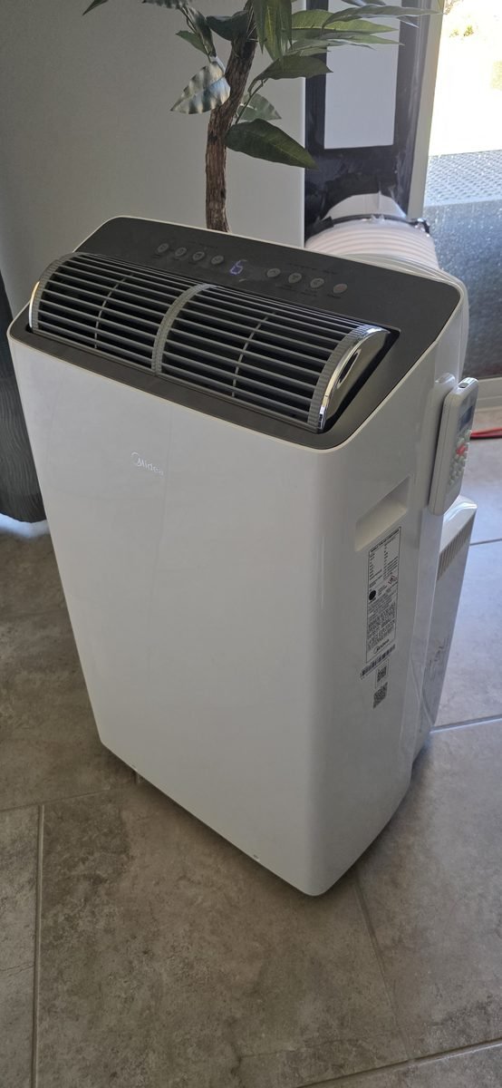 Refurbished Midea 12000 BTU portable air conditioner running on solar generator power