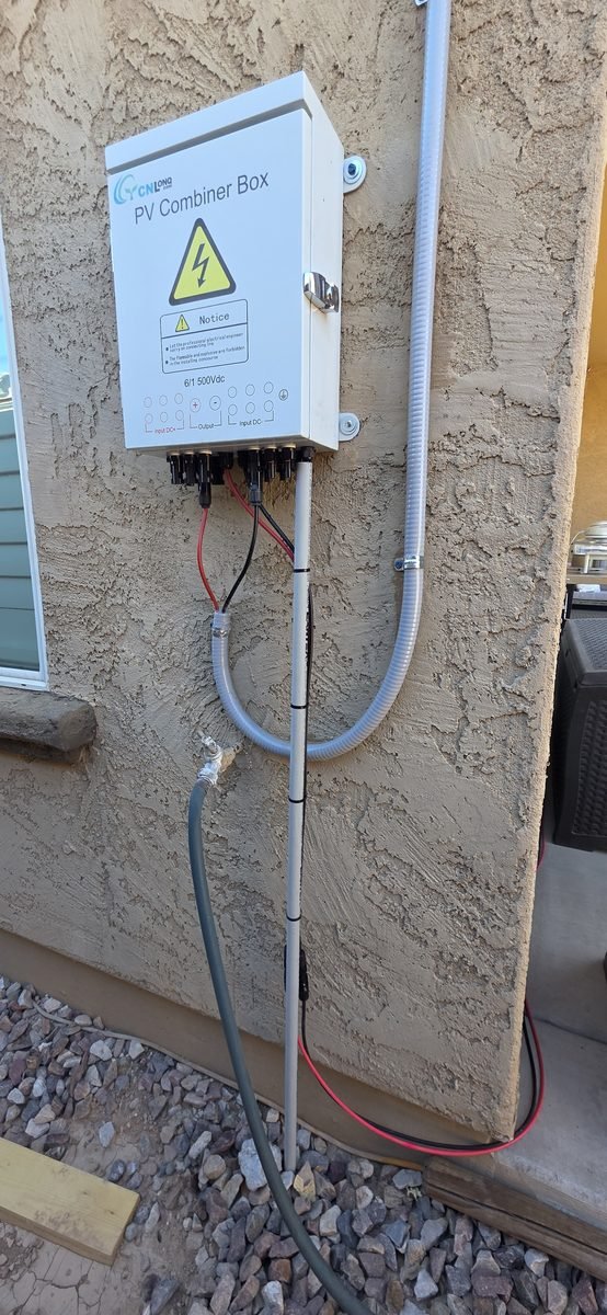 CNL 6/1 500Vdc PV combiner box mounted on stucco wall for a 4-panel home solar setup